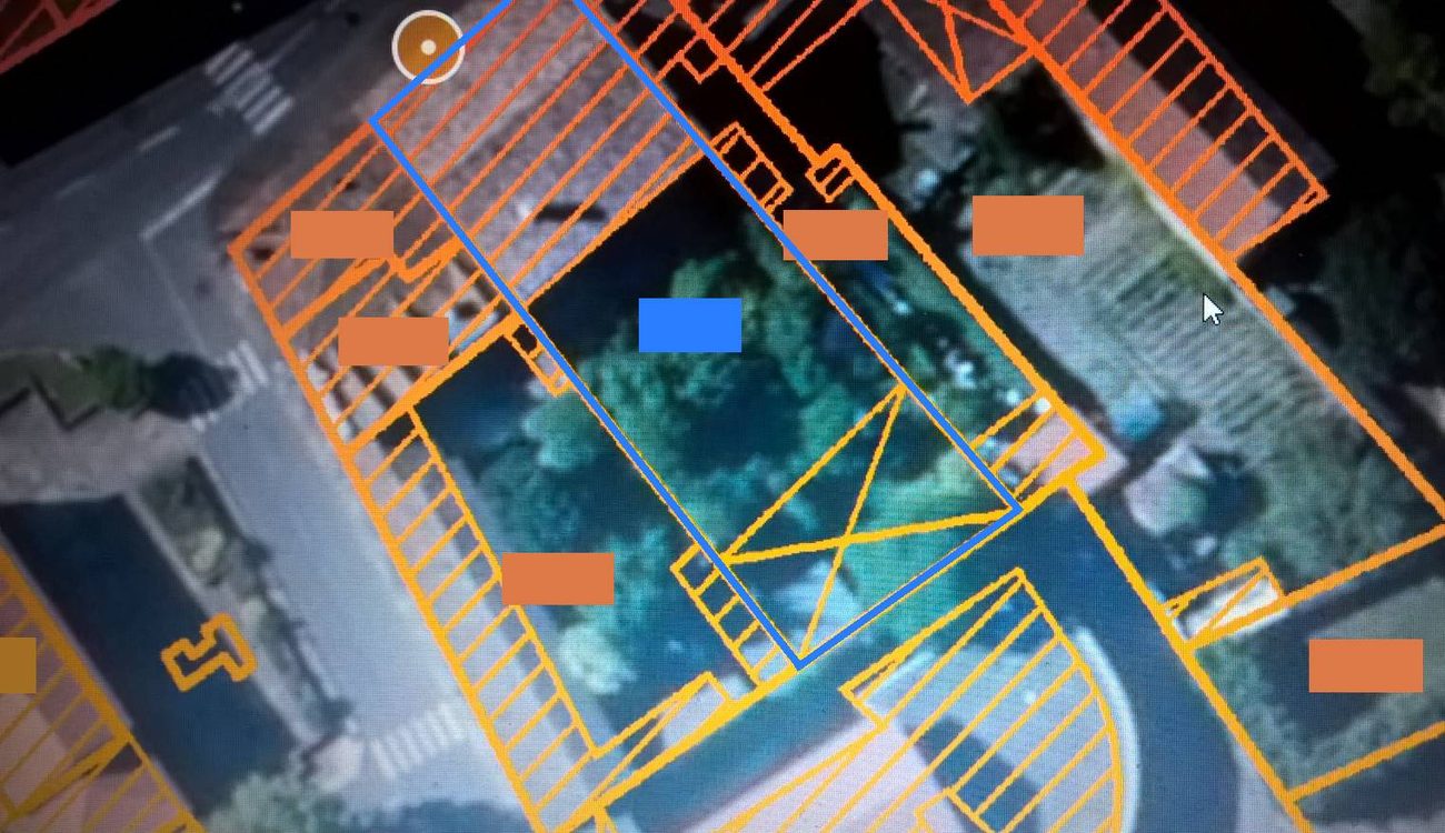 Land registry view of the plot, outlined in blue, at the heart of the village
